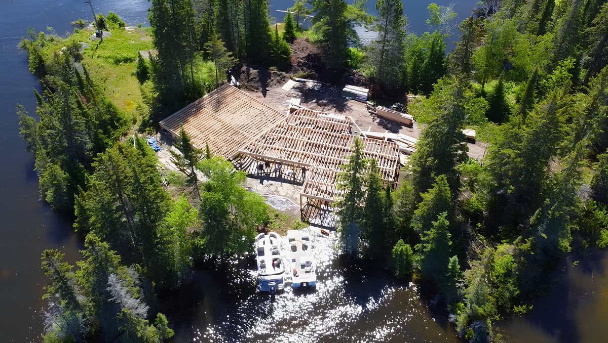 Aerial view of a remote lakeside construction site